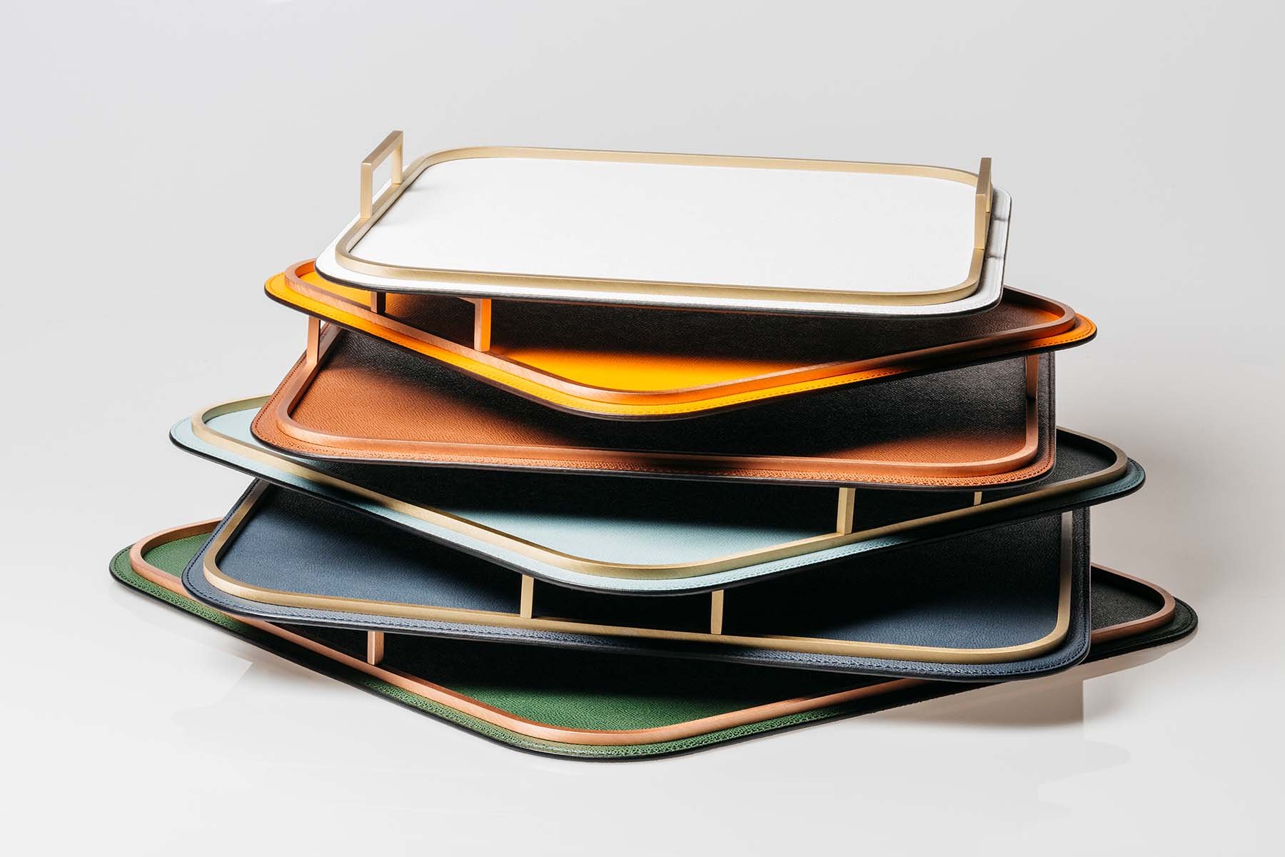 Giobagnara Bellini trays in various leather colours, with brass metal accents
