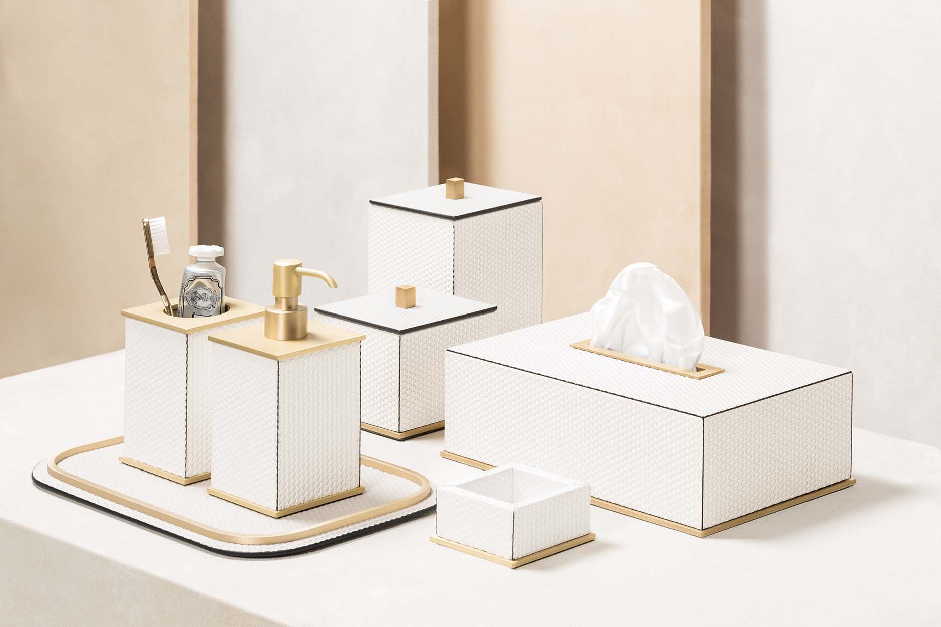 Firenze bathroom collection pictured in white Bellagio leather with brushed brass accents